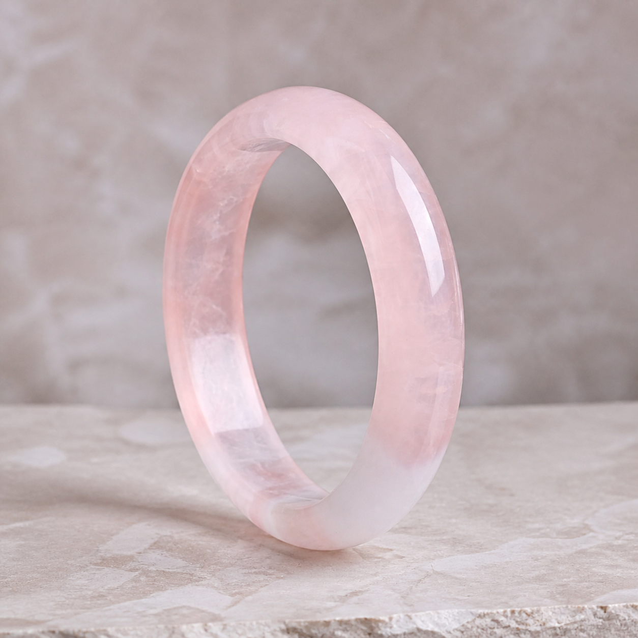 Luna Veil Rose Quartz Bangle photographed on ivory satin