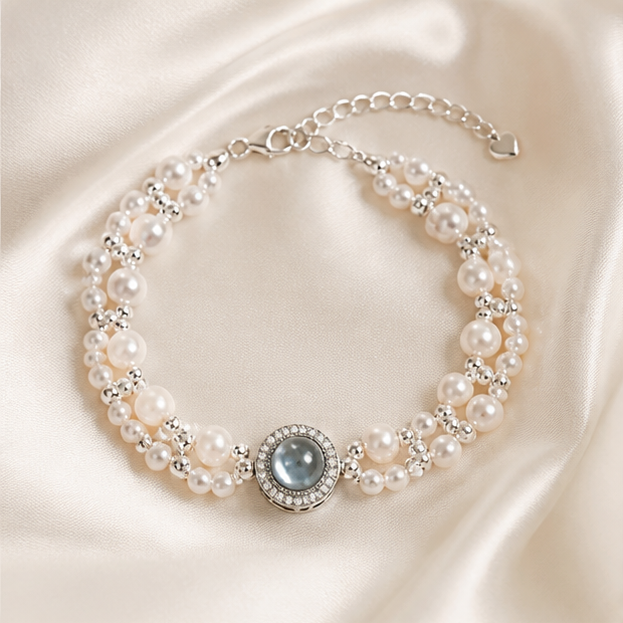 Aquamarine & Pearl Woven Bracelet – Handcrafted in 925 Silver photographed on ivory satin