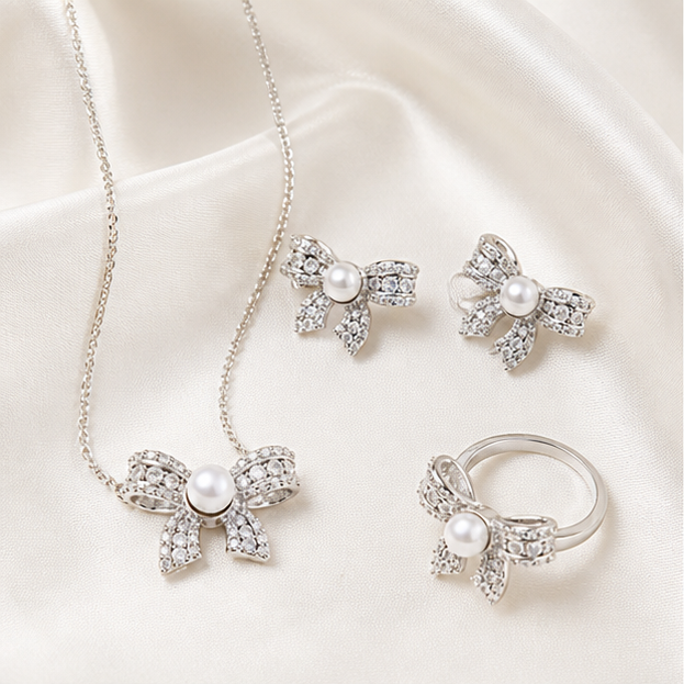 Dazzling Bow Pearl Jewelry Set – 3-Piece Freshwater Pearl Ensemble photographed on ivory satin