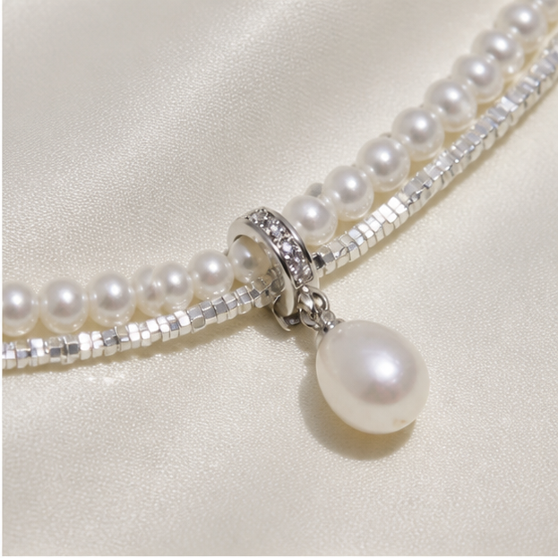Macro product detail of Double-Layer Sterling Silver Pearl Necklace – Drop Pearl & Baby Pearl Shine