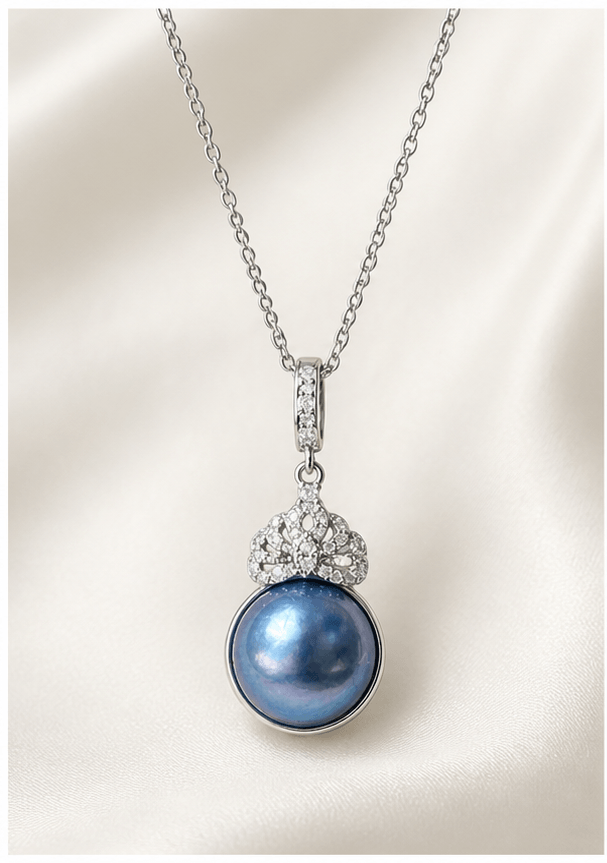 Elysian Pearl Moonlit Mabe Pearl Clasp Pendant in a product-only ivory studio setting