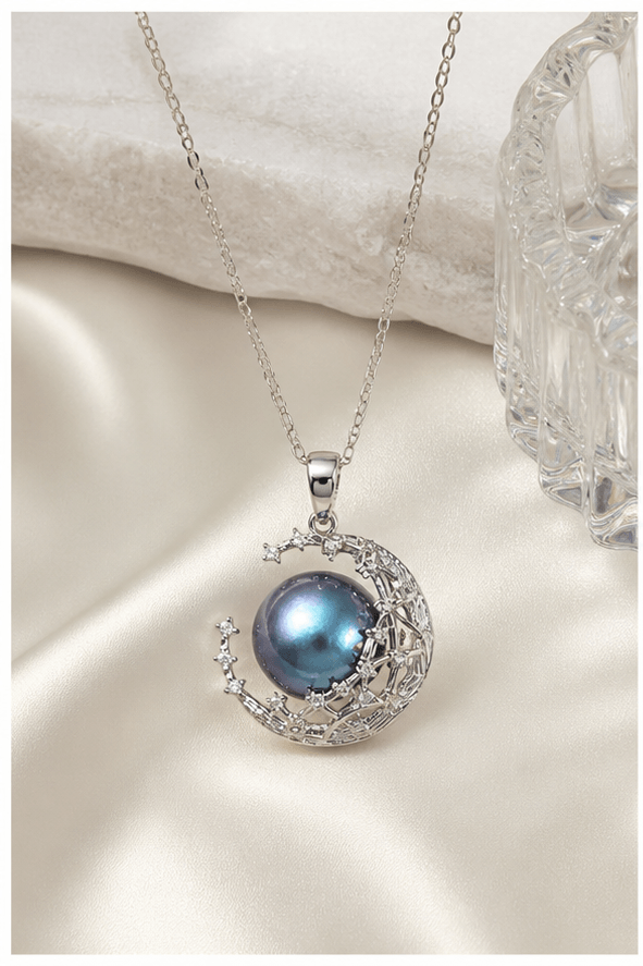 Elysian Pearl Blue Mabe Moon Crown Necklace in a product-only ivory studio setting
