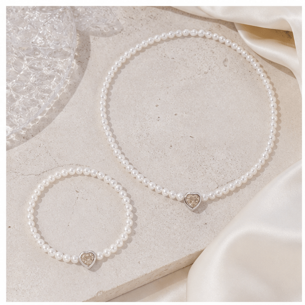 Elysian Pearl Blush Heart Pearl Jewellery in a product-only ivory studio setting