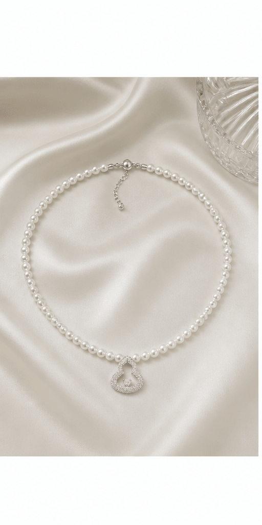 Elysian Pearl Gourd Freshwater Pearl Necklace in a product-only ivory studio setting