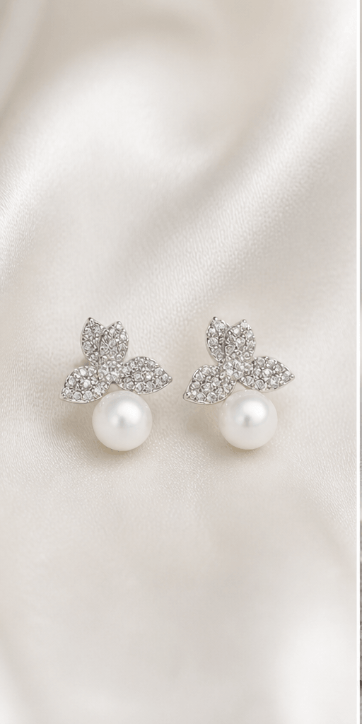 Elysian Pearl Three Petal Pearl Stud Earrings in a product-only ivory studio setting