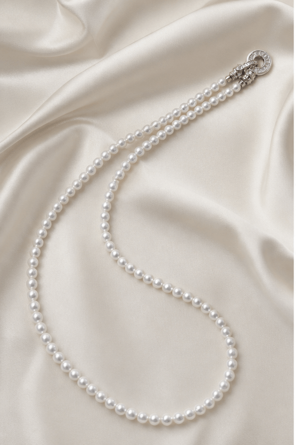 Elysian Pearl Fine Pearl Ring Clasp Necklace in a product-only ivory studio setting