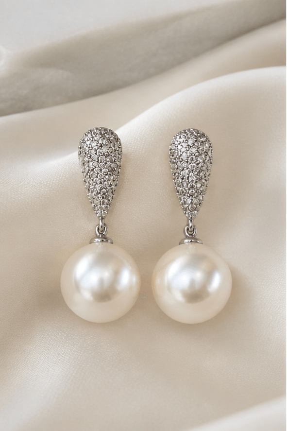 Elysian Pearl Edison Pearl Drop Earrings in a product-only ivory studio setting