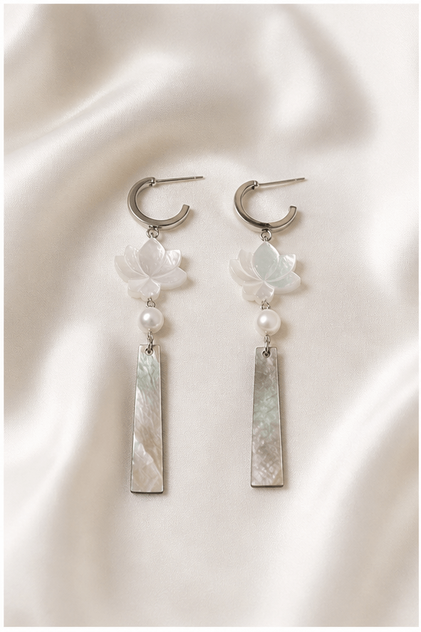 Elysian Pearl Lotus Shell Pearl Tassel Earrings in a product-only ivory studio setting