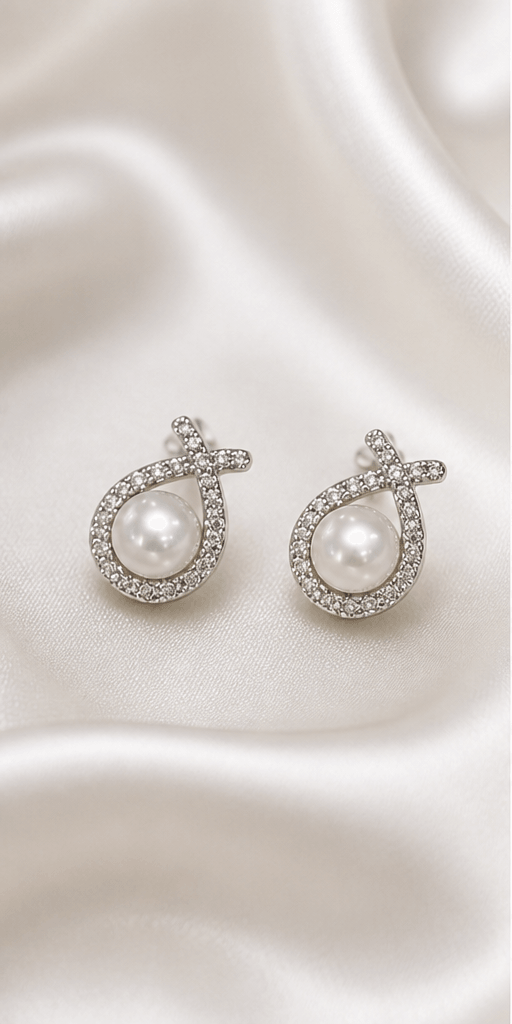 Elysian Pearl Fishtail Pearl Ear Cuffs in a product-only ivory studio setting