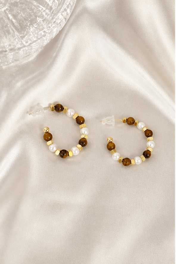 Elysian Pearl Tiger Eye Pearl Drop Earrings in a product-only ivory studio setting