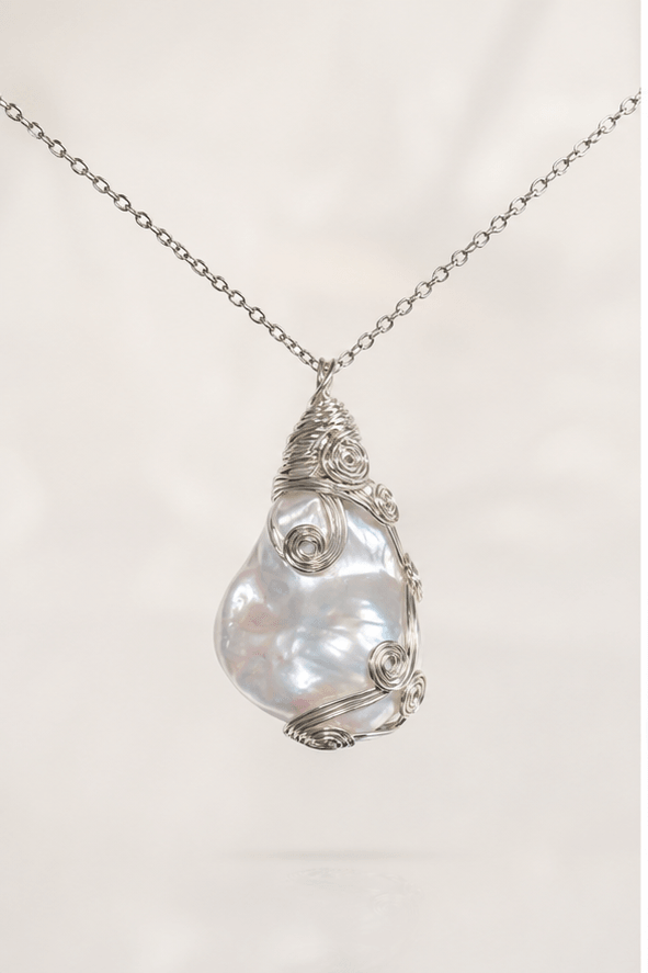 Elysian Pearl Wire Wrapped Baroque Pearl Pendant in a product-only ivory studio setting