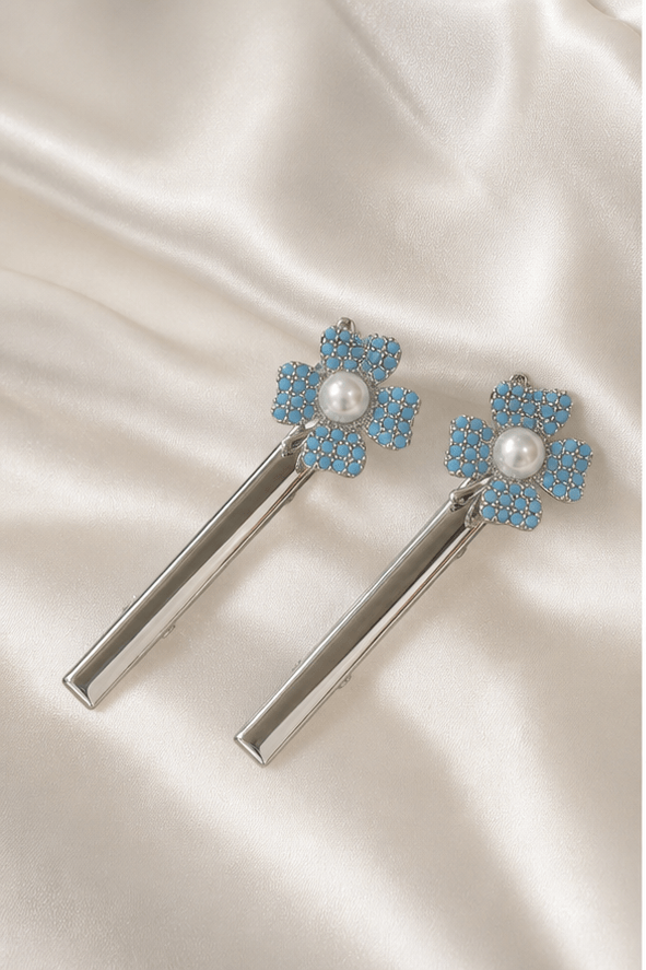 Elysian Pearl Blue Clover Pearl Hair Clip in a product-only ivory studio setting