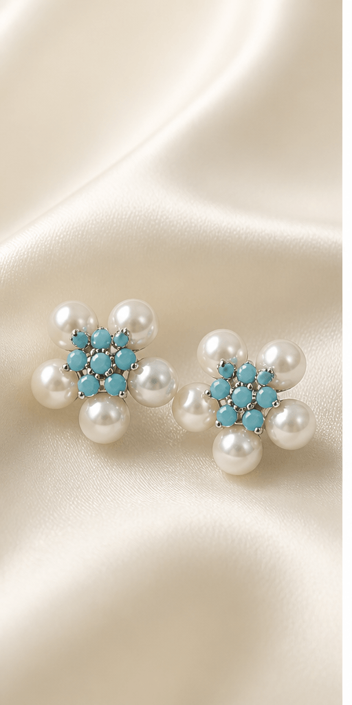Elysian Pearl Five Petal Pearl Stud Earrings in a product-only ivory studio setting
