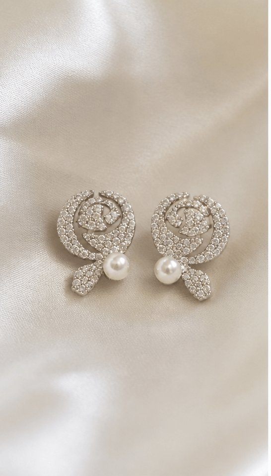 Elysian Pearl Rose Pearl Stud Earrings in a product-only ivory studio setting