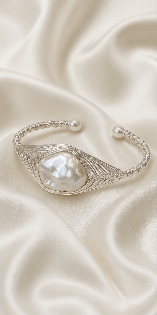 Elysian Pearl Wire Wrapped Baroque Pearl Bangle in a product-only ivory studio setting