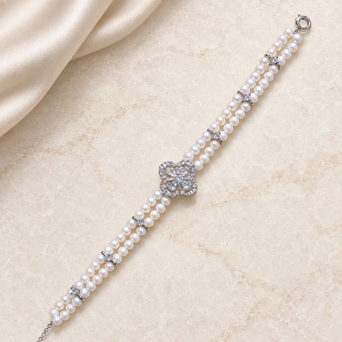 Clover Duet – Double-Row Freshwater Pearl Bracelet — styled ivory flat-lay overview
